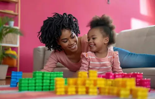 African mother playing with her child